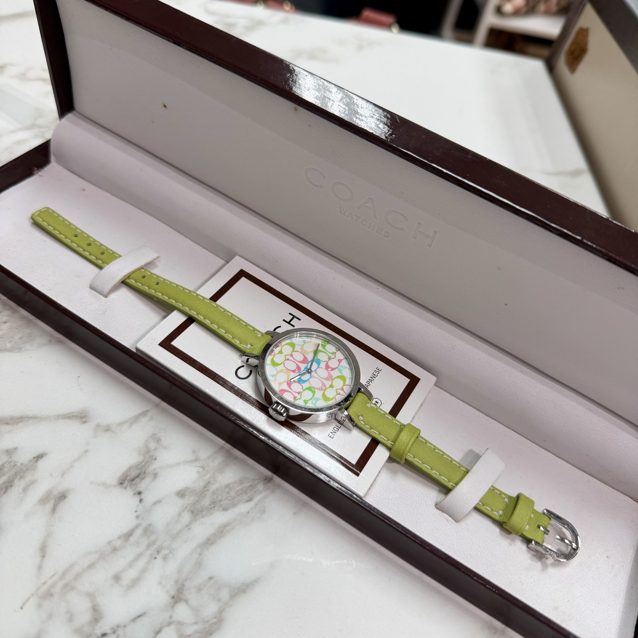 Coach Signature Logo Green Women's Watch with lime green leather strap, multicolor signature logo dial, and original Coach presentation box.